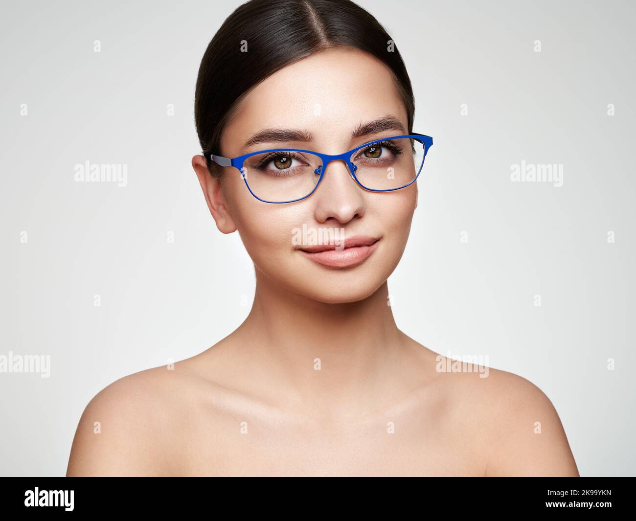 Woman with long eyelashes in eyeglasses. Vision correction. Poor