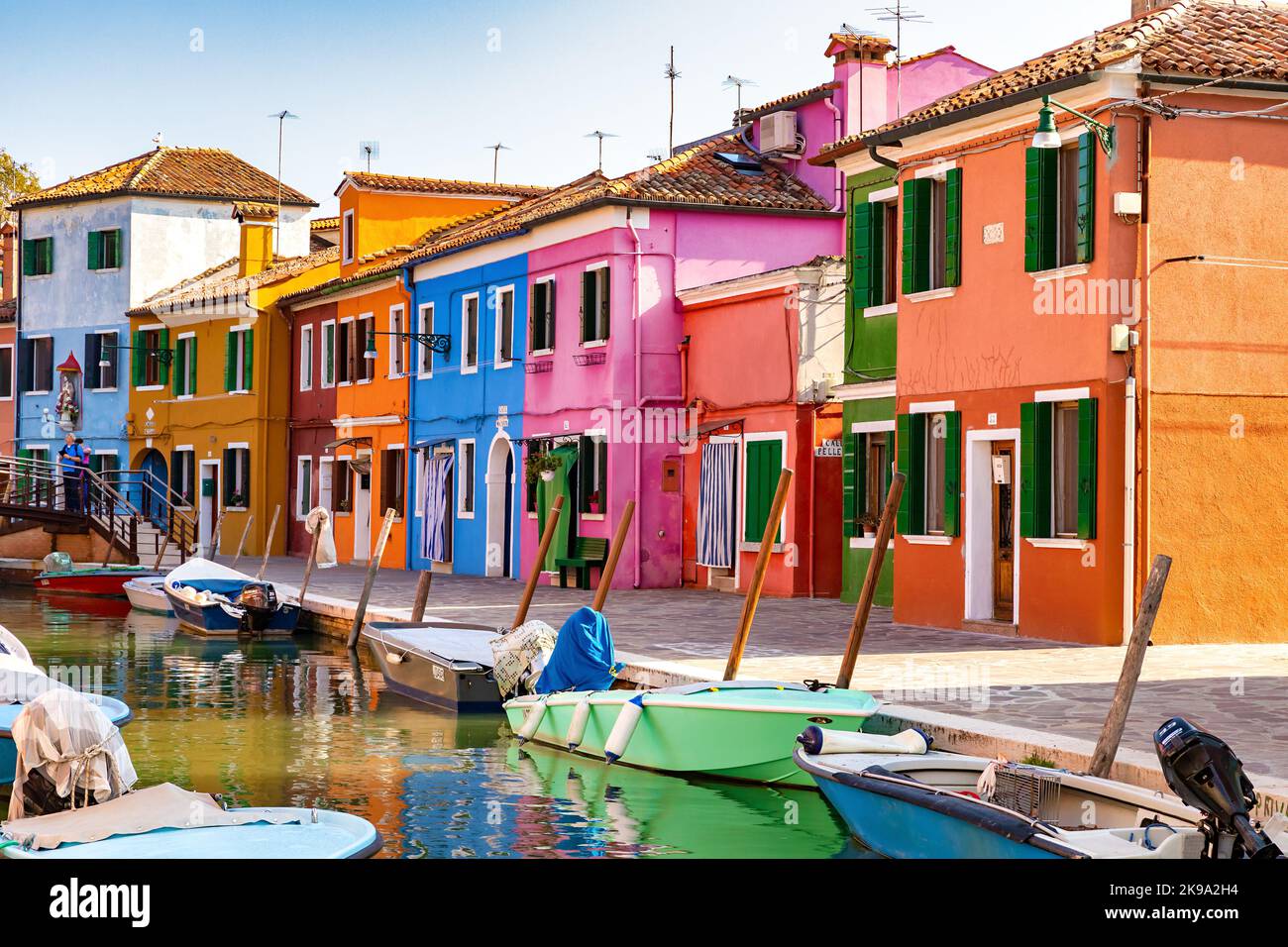 Canal with boats and colorful houses of the Burano Island in Venice, Italy Stock Photo