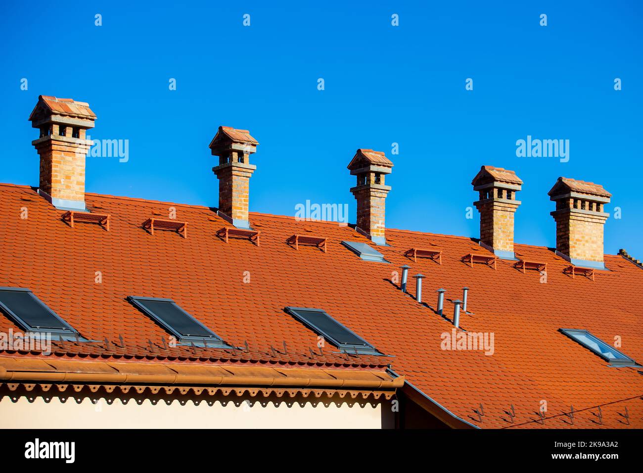 Detail of red roof with chimnies at blue sky Stock Photo Alamy
