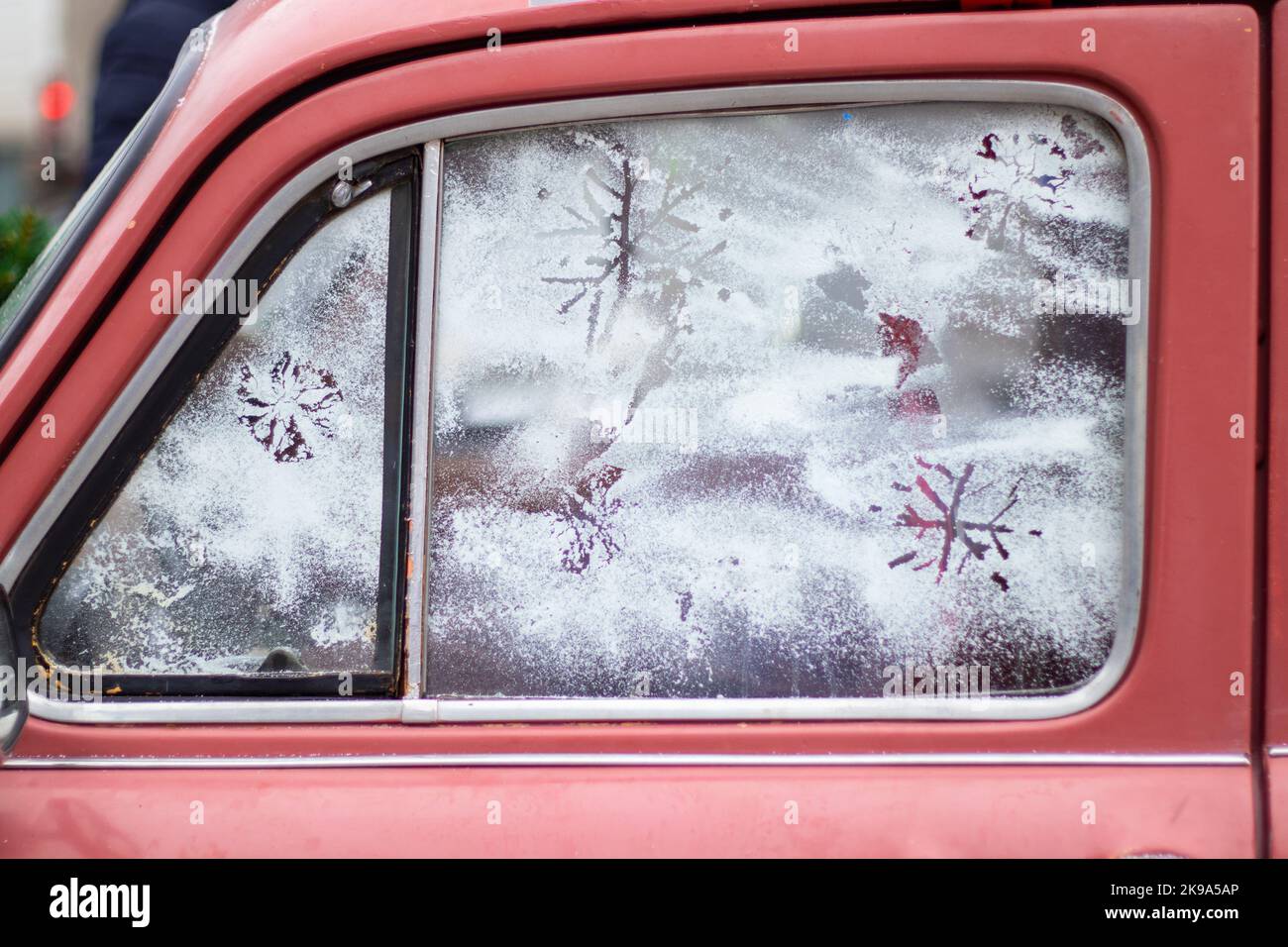 snowflake on the glass of an old car, new year holiday Stock Photo