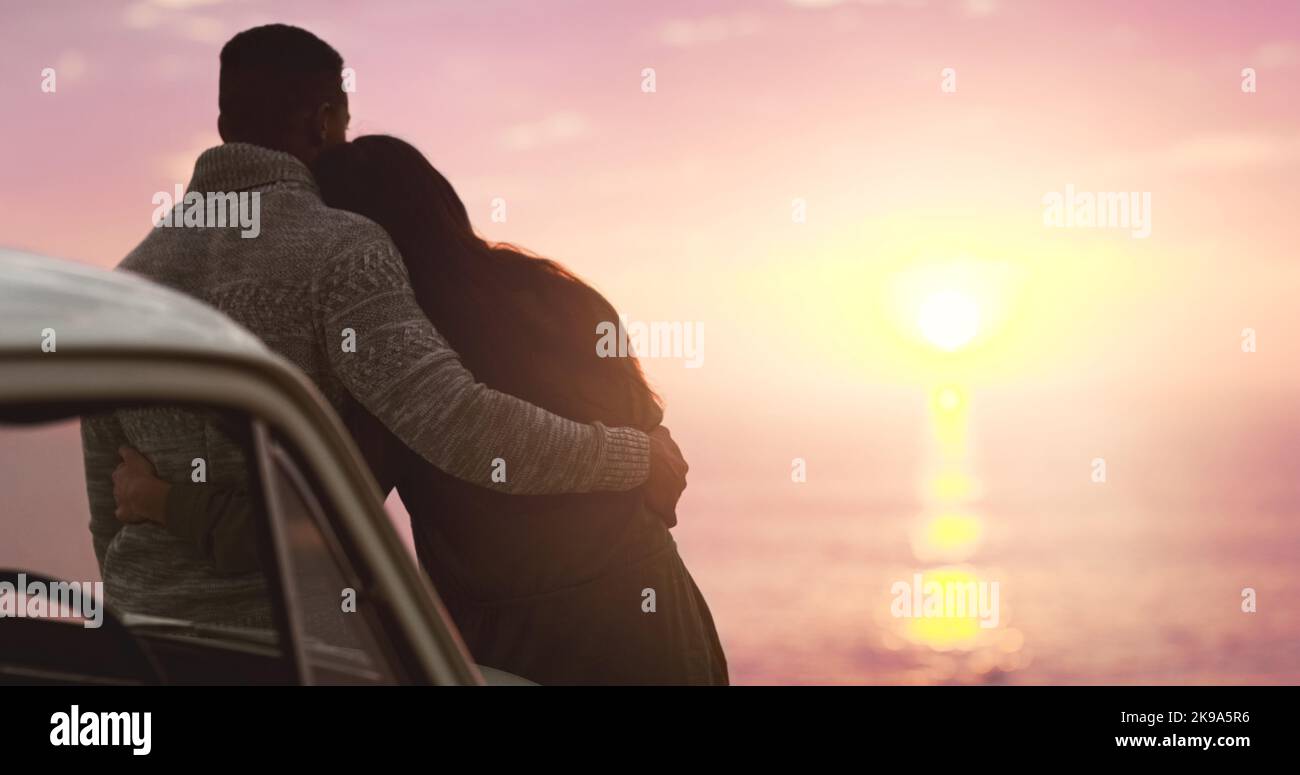 Woman watching sunset beach arms hi-res stock photography and images ...