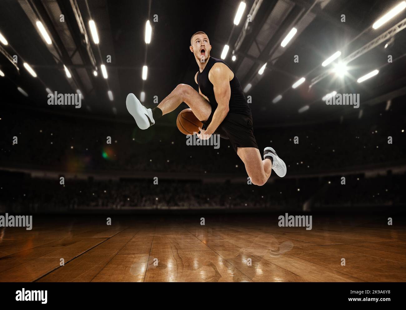 High jump. Young professional basketball player playing basketball at