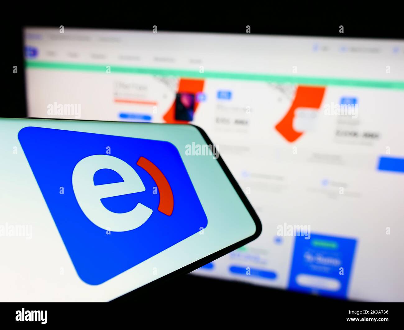 Mobile phone with logo of telecommunications company Entel Chile on screen in front of business website. Focus on center of phone display. Stock Photo