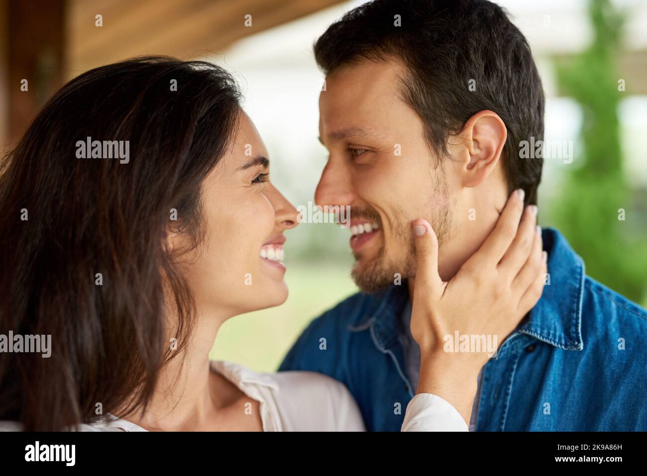 We always find love in each others eyes. an affectionate young couple spending some time together at home. Stock Photo