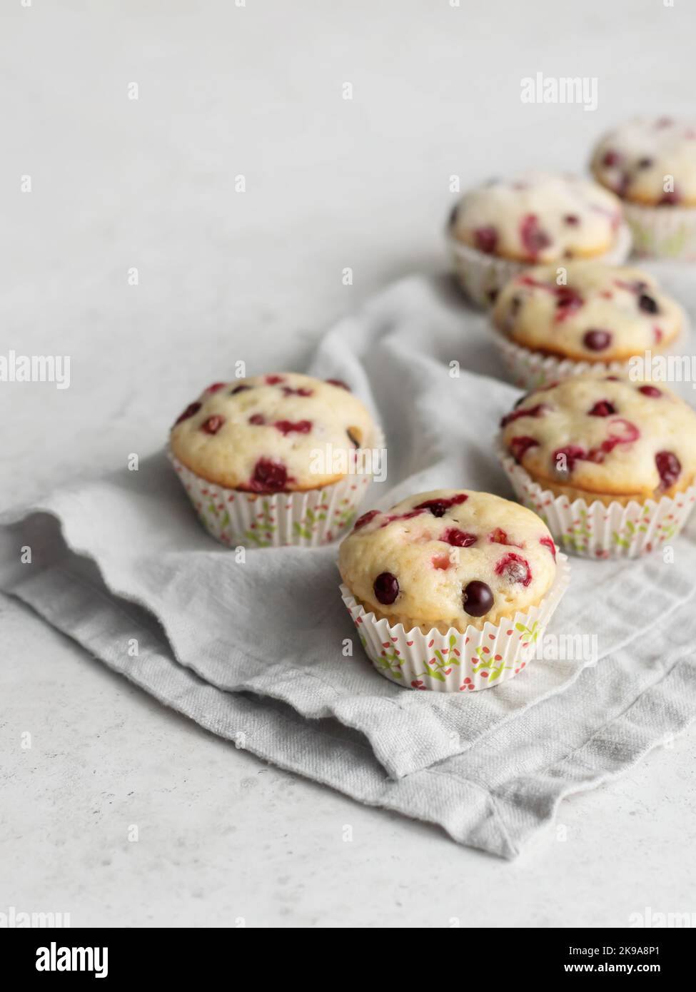Cranberry muffins on linen napkin with text space Stock Photo