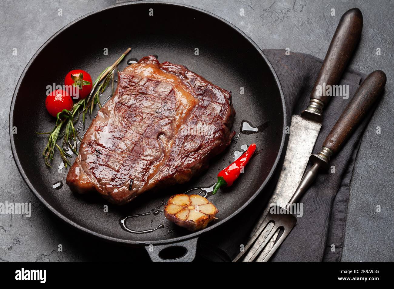 Grilled ribeye beef steak in frying pan Stock Photo Alamy