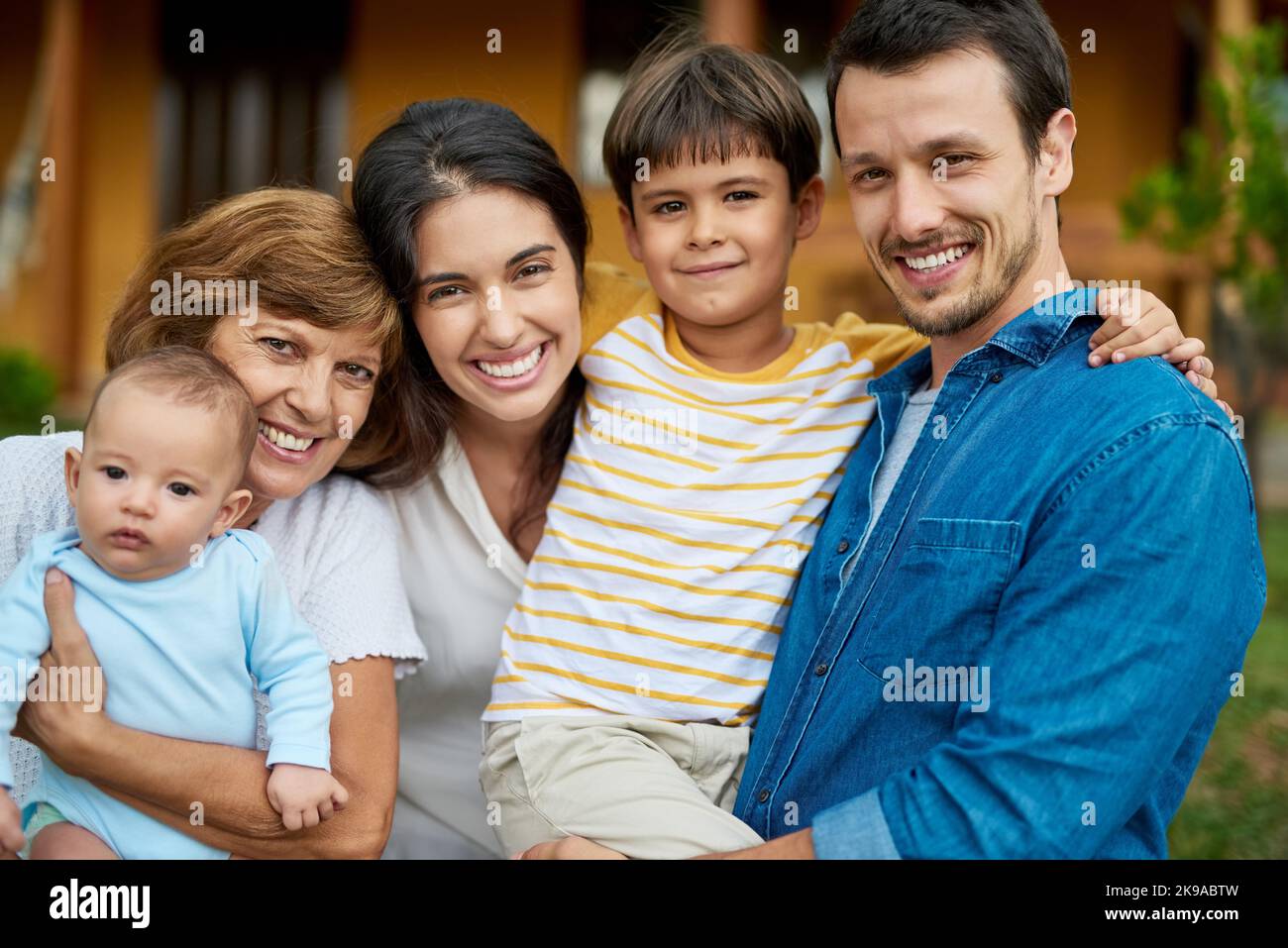 Passing down love from generation to generation. Portrait of a beautiful family spending some time together outdoors. Stock Photo