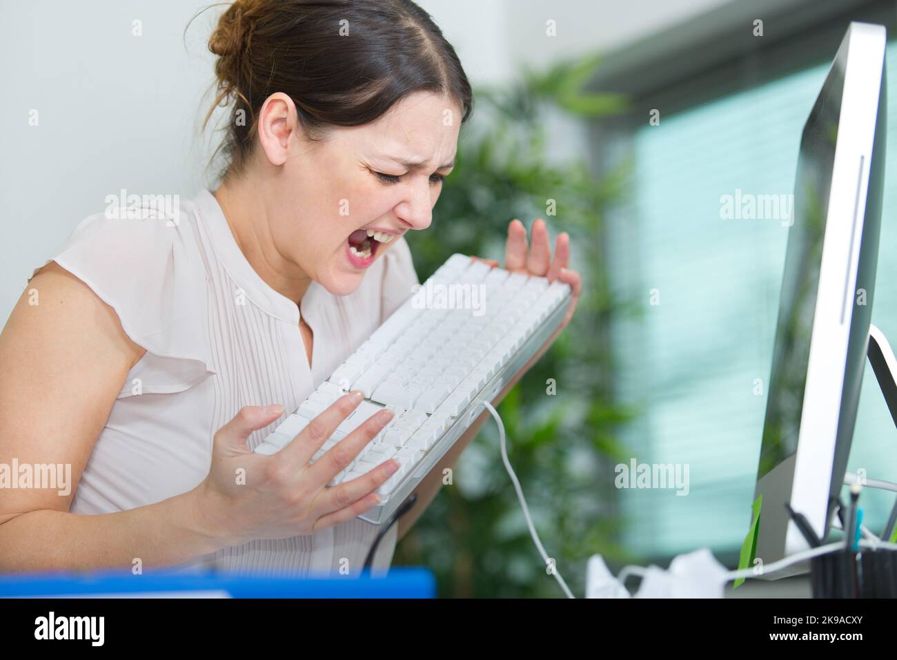 angry woman screaming out and pulling her hair Stock Photo Alamy