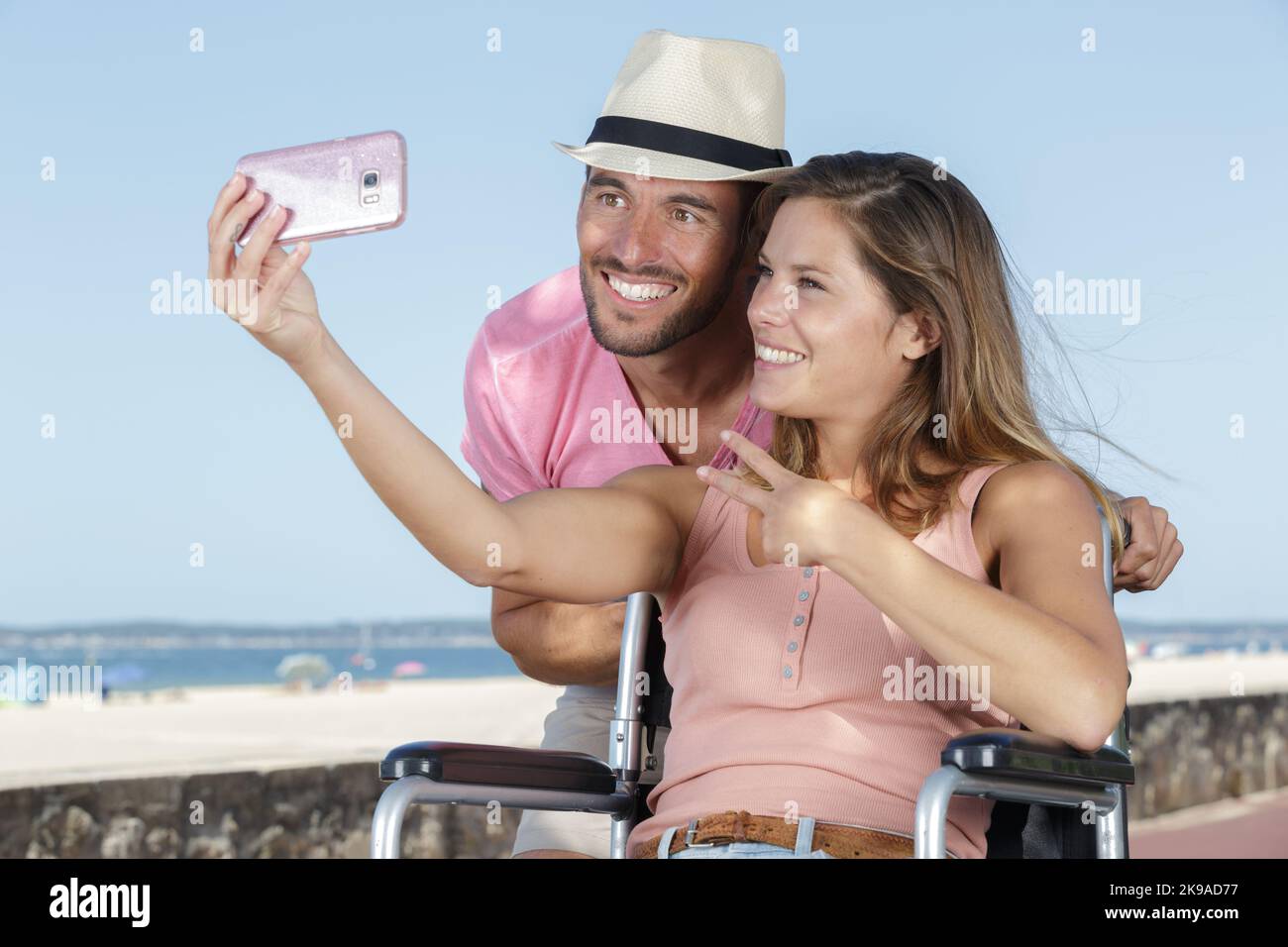 young girl on wheelchair taking a selfie with boyfriend Stock Photo - Alamy