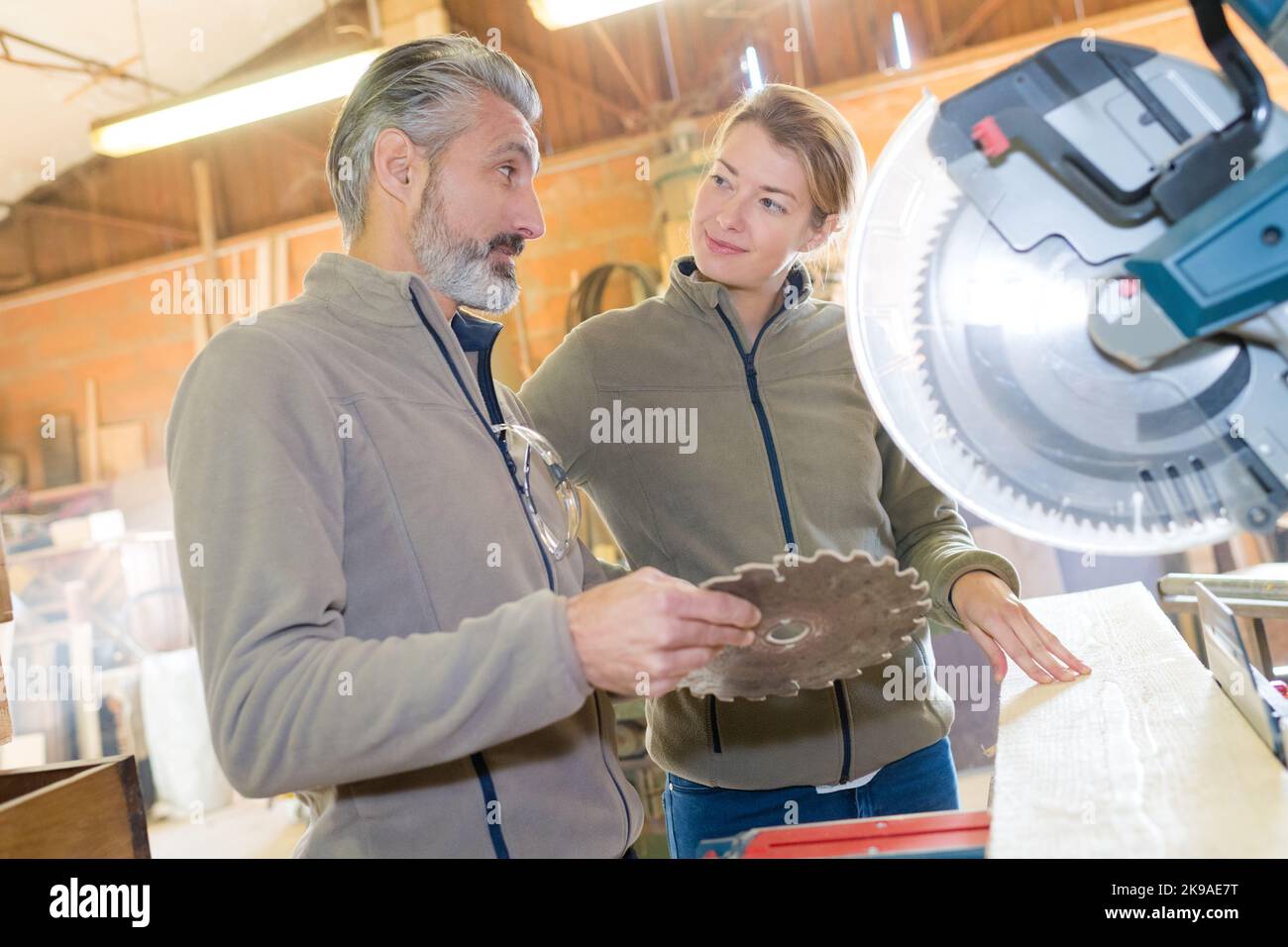 woman is ready to working on circular saw Stock Photo