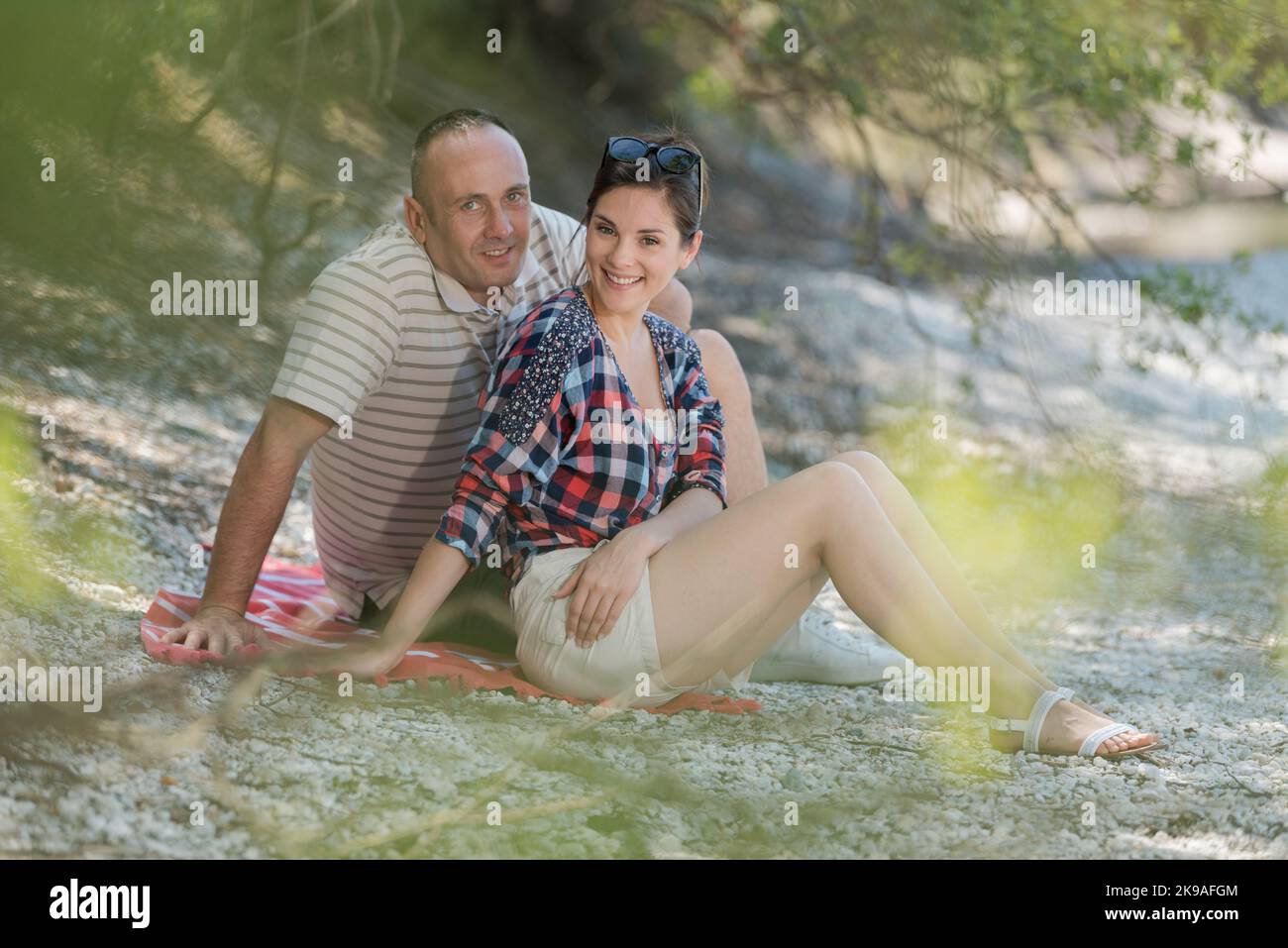 Couple sat on riverside hi-res stock photography and images - Alamy