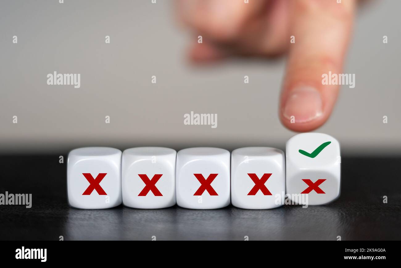 Symbol for never giving up. Hand turns dice and changes the x sign to a ...