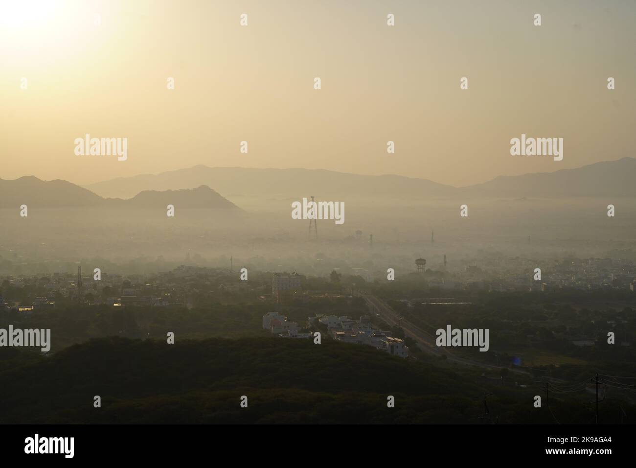 A thick blanket of dust and haze envelops the city skyline a day after
