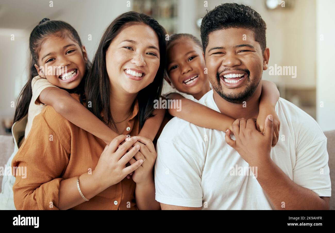Asian family, smile and portrait with love, laugh and relax together in a happy home on a fun weekend for bonding. Happiness, mother and father Stock Photo