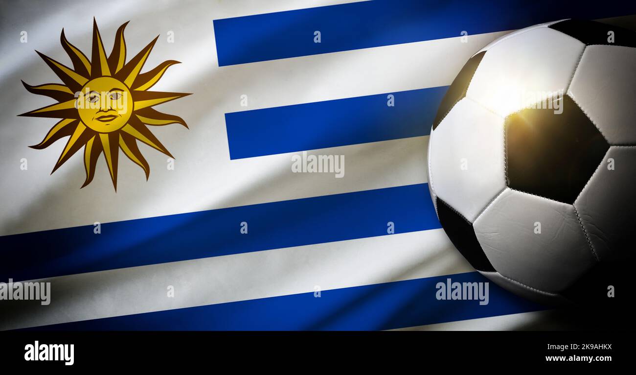 Uruguay national team composition with classic ball on grass and flag in the background. Top view. Stock Photo