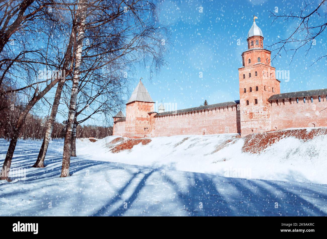 Veliky Novgorod Russia. Veliky Novgorod Kremlin fortress in sunny winter day during the snowfall. Focus at the Kremlin, travel landscape Stock Photo
