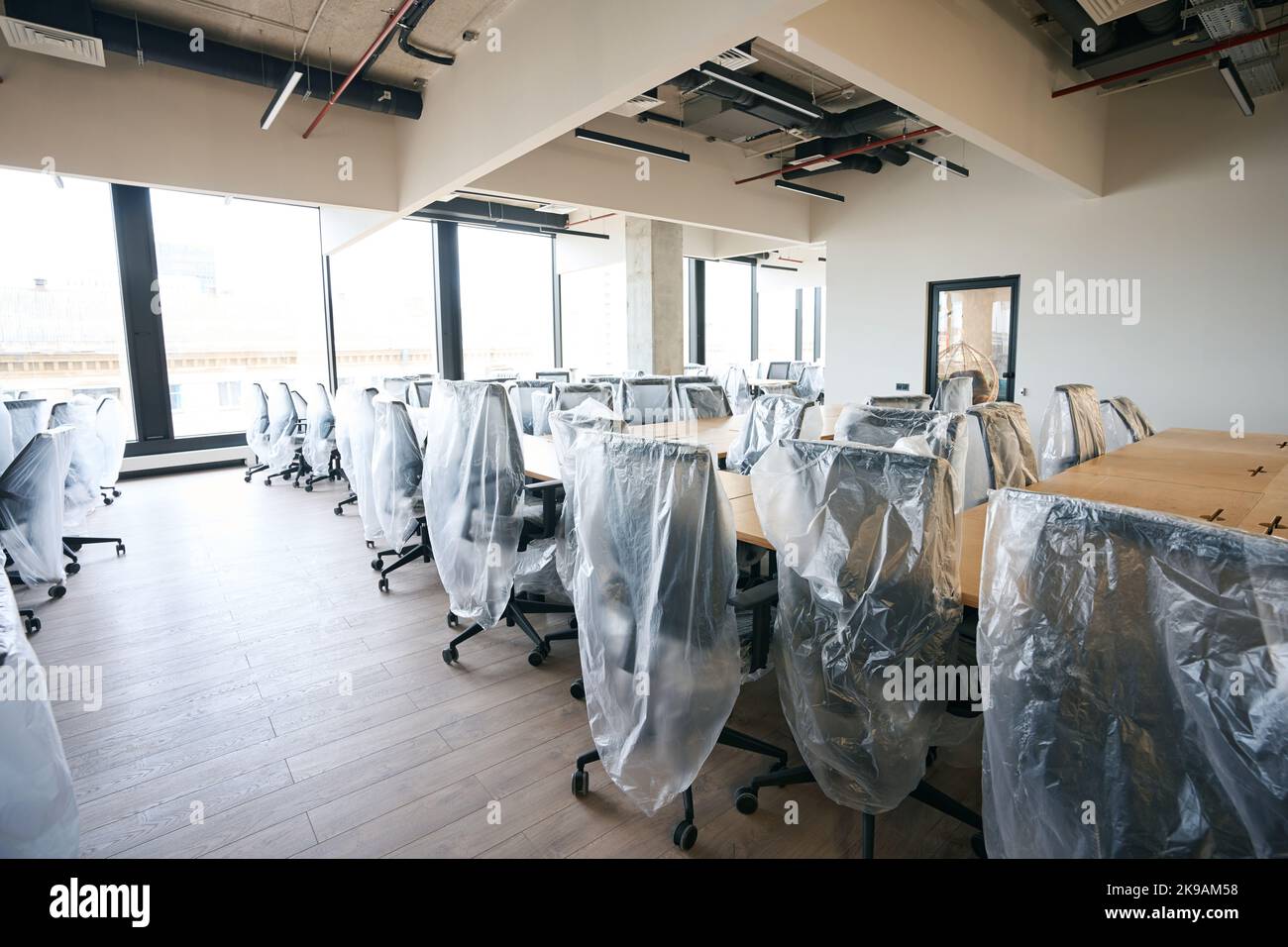 Coworking area after general cleaning, clean room with covered furniture Stock Photo Alamy