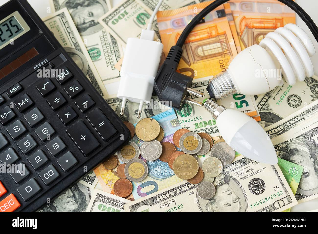 Calculator, euro and dollar banknotes, coins. Tax time, bill payment