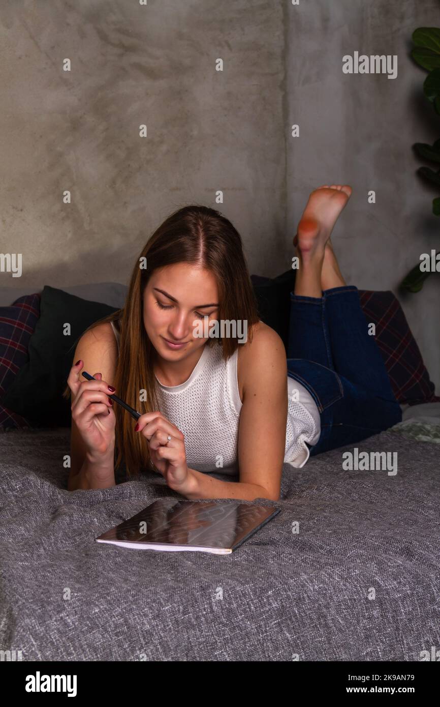 Barefoot girl lying on couch hi-res stock photography and images - Alamy