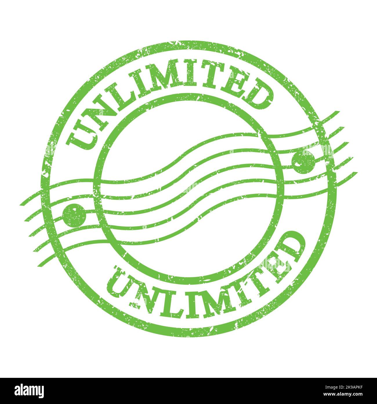 UNLIMITED, text written on green grungy postal stamp. Stock Photo
