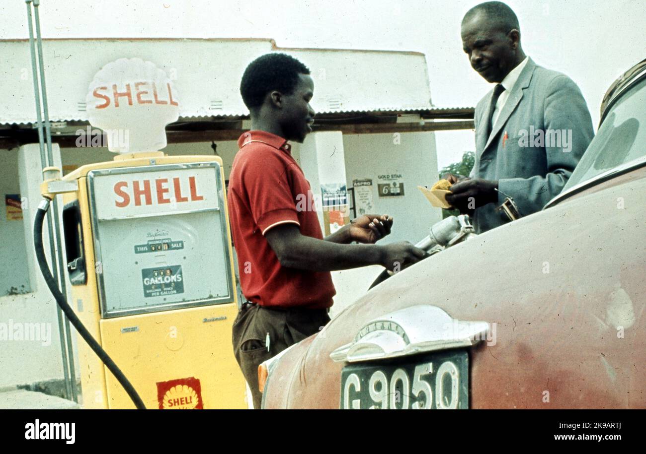 Car Being Filled At Petrol Garage, Shell Pump, Africa, 1970s   Photo by Henshaw Archive Stock Photo