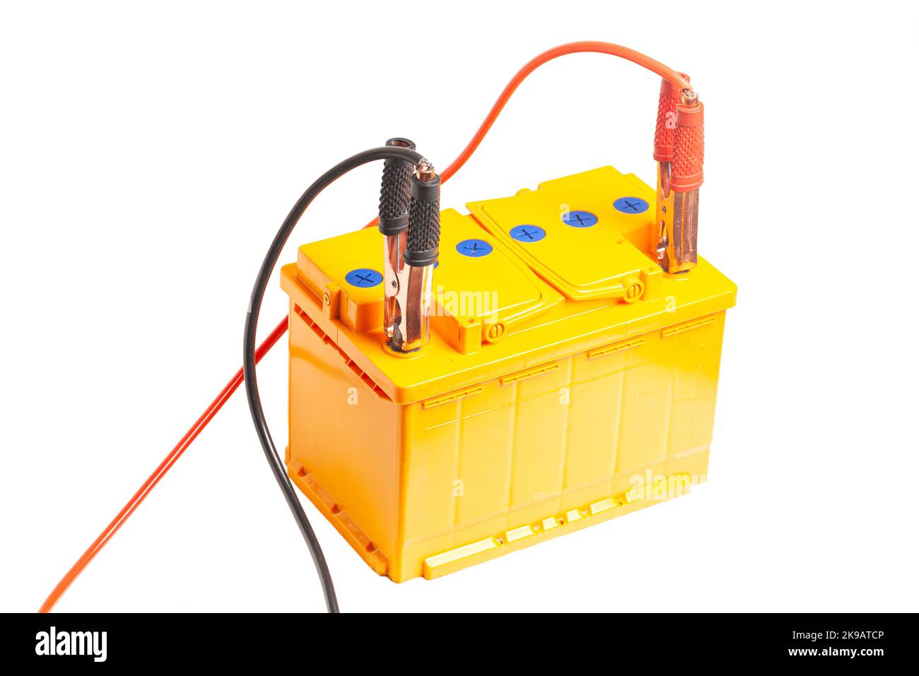 Charging the car acid battery. The charger terminals are connected to the battery. Car acid