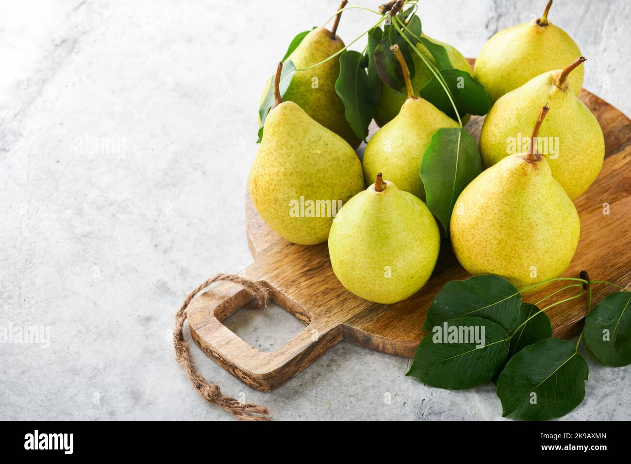 https://c8.alamy.com/comp/2K9AXMN/pears-fresh-sweet-organic-pears-with-leaves-on-stand-or-plate-on-old-stone-tile-background-frame-of-autumn-harvest-fruits-top-view-food-background-2K9AXMN.jpg