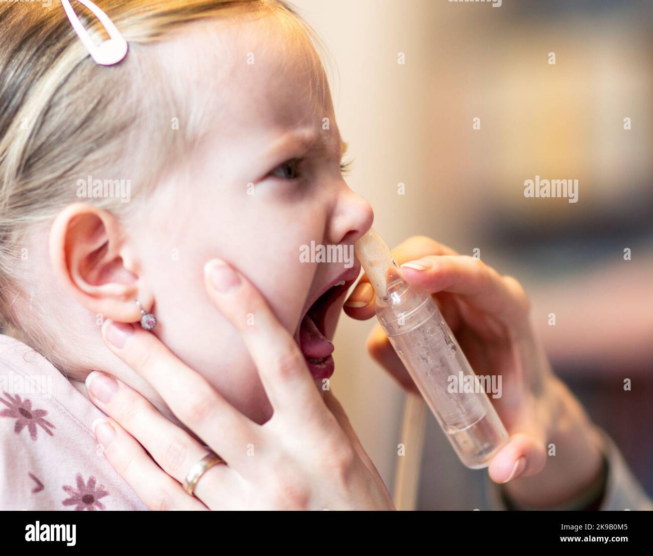 https://c8.alamy.com/comp/2K9B0M5/mother-cleaning-baby-nose-nasal-aspiration-connected-to-vaccum-cleaner-2K9B0M5.jpg