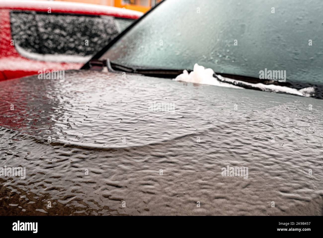 Frozen car covered by icy rain in winter. Stock Photo