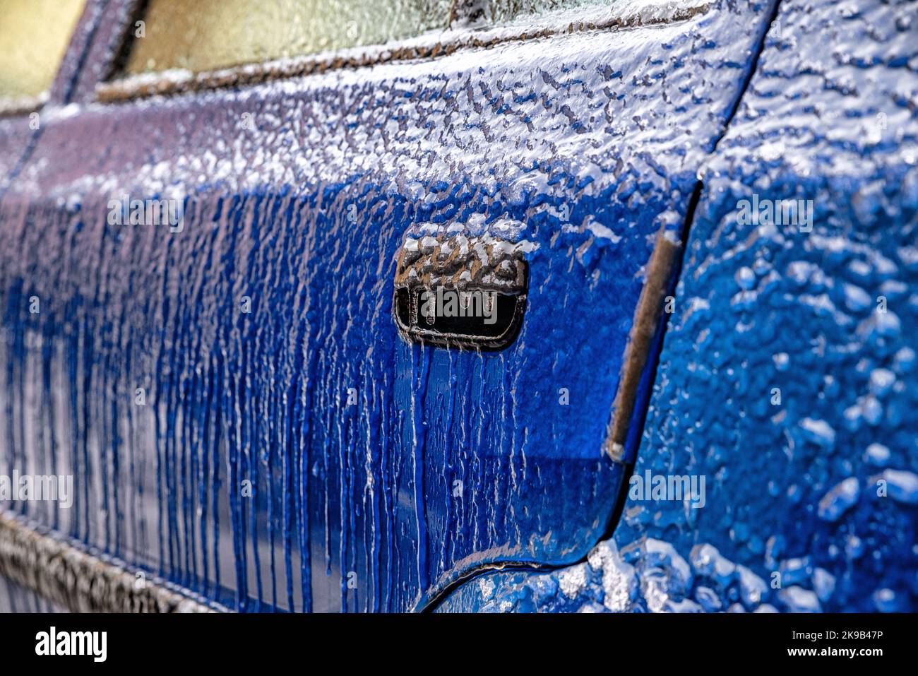 Detail of car covered by icy rain in winter. Stock Photo
