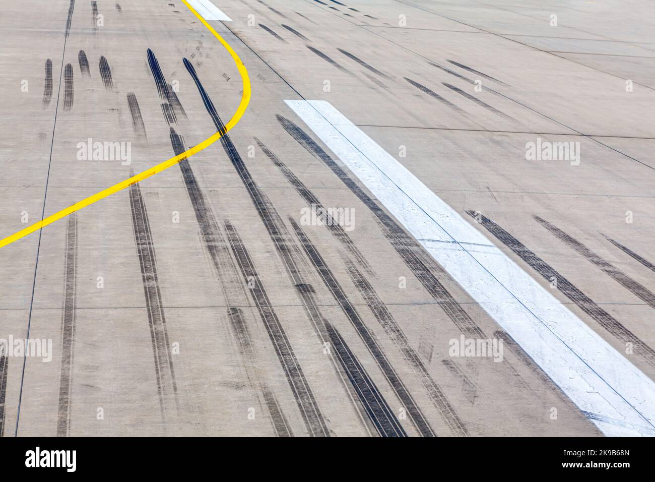 Traces of the aircraft at runway . Ground along which aircraft take off and land Stock Photo