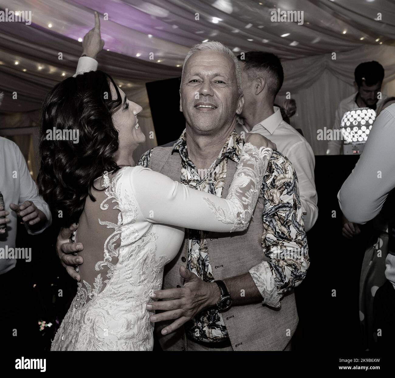 Bride dancing at wedding with guest. Stock Photo