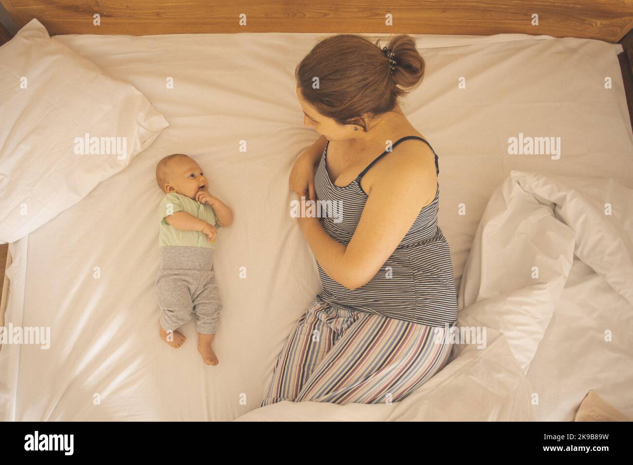 Mother and newborn baby sleep in the bed Stock Photo Alamy