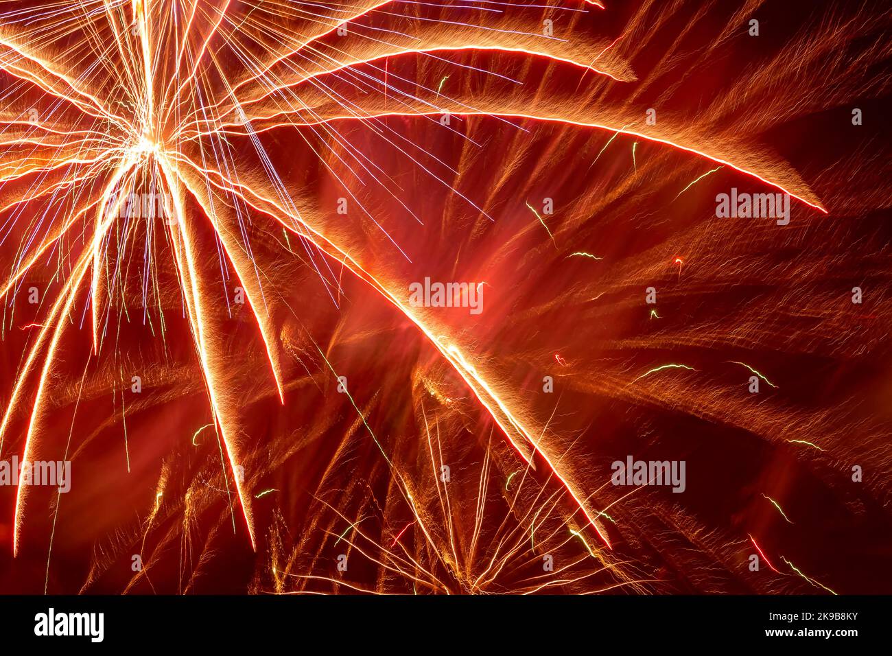 abstract holiday background: view on bright fireworks in night sky ...