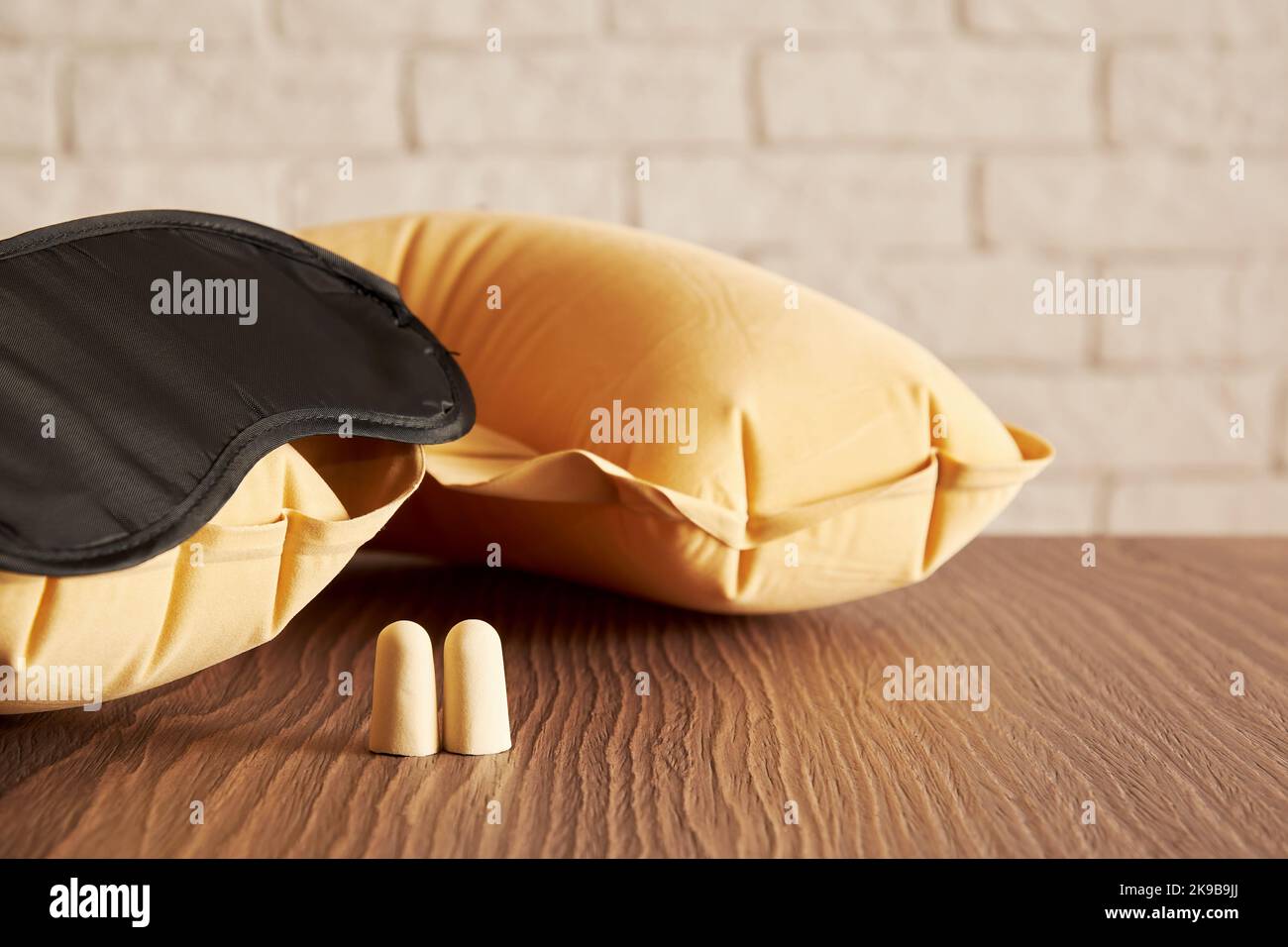 Sleeping accessories, mask, earplugs, pillow for long trips. Sleep care and symbols Stock Photo