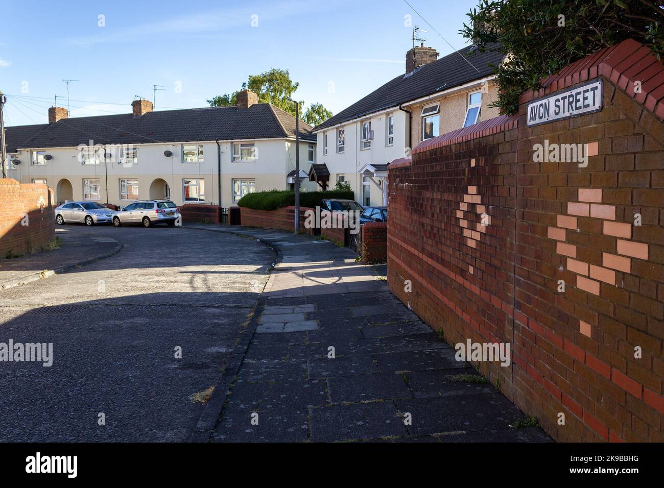 Birkenhead, UK: Avon Street, houses, wall, and road sign in the Merseyside town Stock Photo