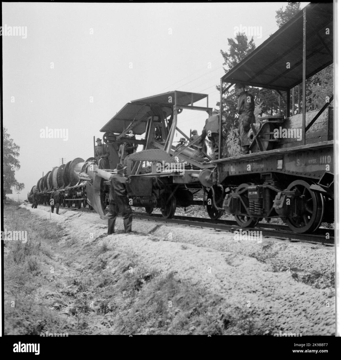 Cable output train. Plusing telecommunications in the embankment before ...