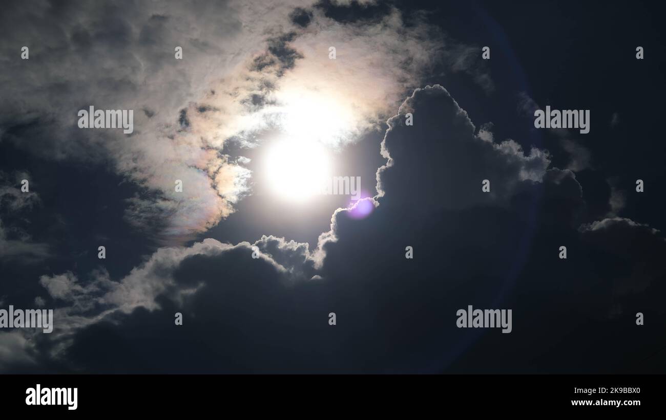 Aerial view of beautiful sky with clouds and sun on a summer day. Time ...