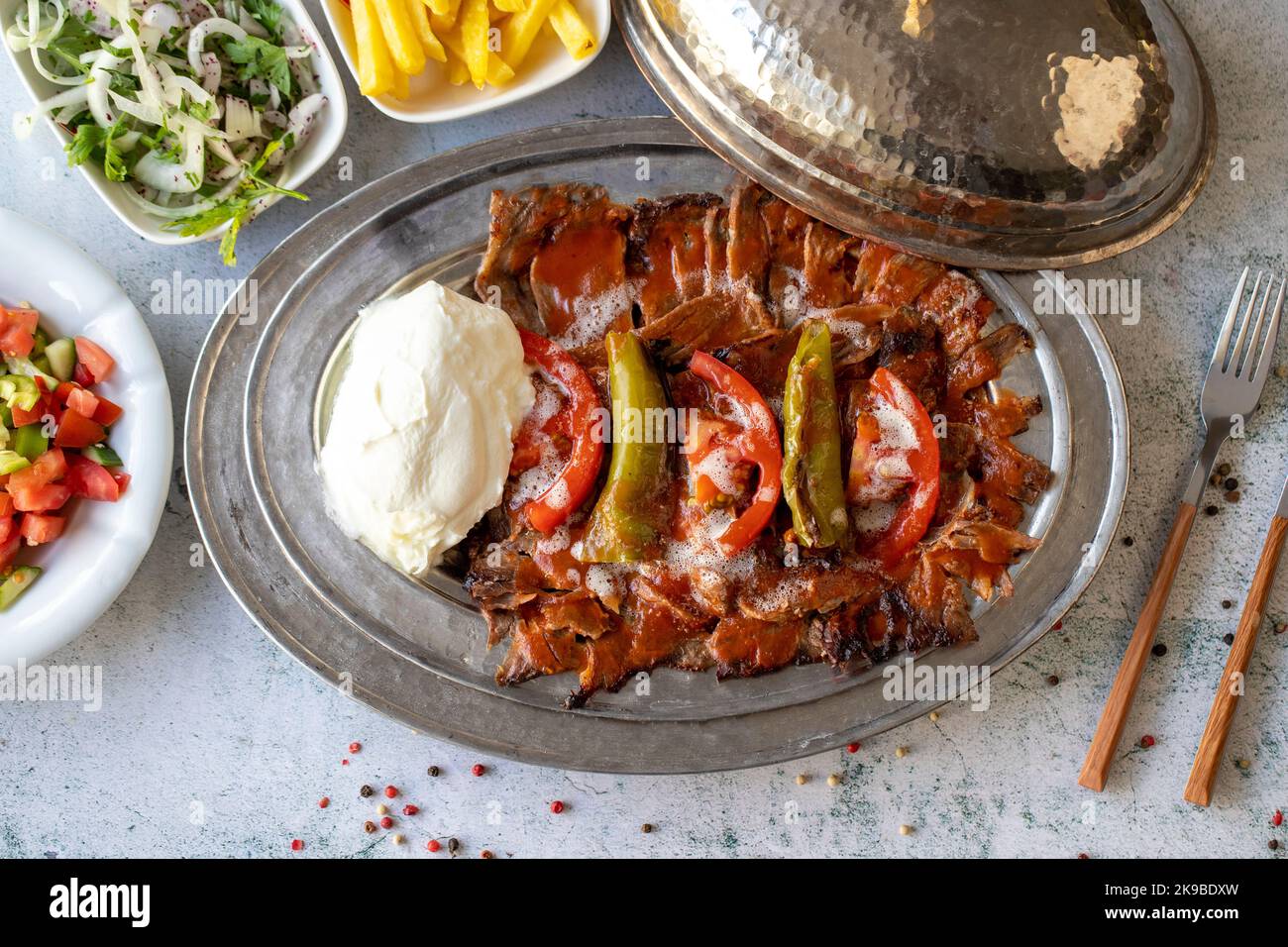 Turkish iskender kebab on gray background. Traditional flavors. Doner