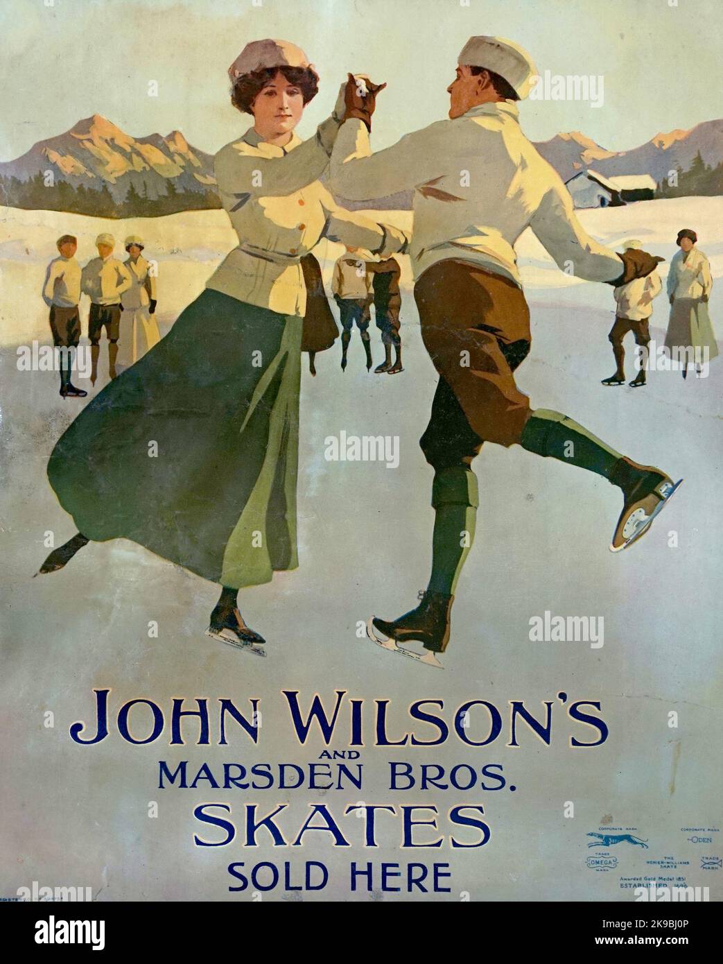 John Wilsons and Marsden Brothers Skates Sold Here. Poster from circa 1920. This litho poster features British figure skaters Phyllis Johnson and James H. Johnson won the silver medal in the pairs event at the 1908 Summer Olympics in London, the first time the event had been allowed. The Johnsons allowed Sheffield skate makers John Wilson's to name a model of ice skates in their honour. Wilson's toolmaking business was begun in Sheffield in the 1600s and in 1696 they first supplied skates to royalty. Wilson's are still manufacturing skates in the city albeit under American ownership. Stock Photo