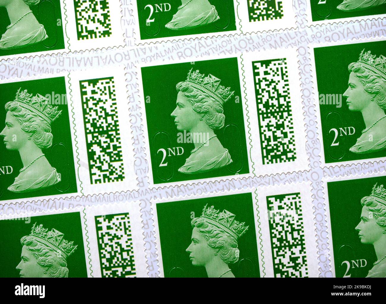 UK 2nd Class Royal Mail postage stamps. New design with a unique barcode introduced Feb 2022. Old non-barcoded stamps only valid up to 31st Jan 2023. Stock Photo
