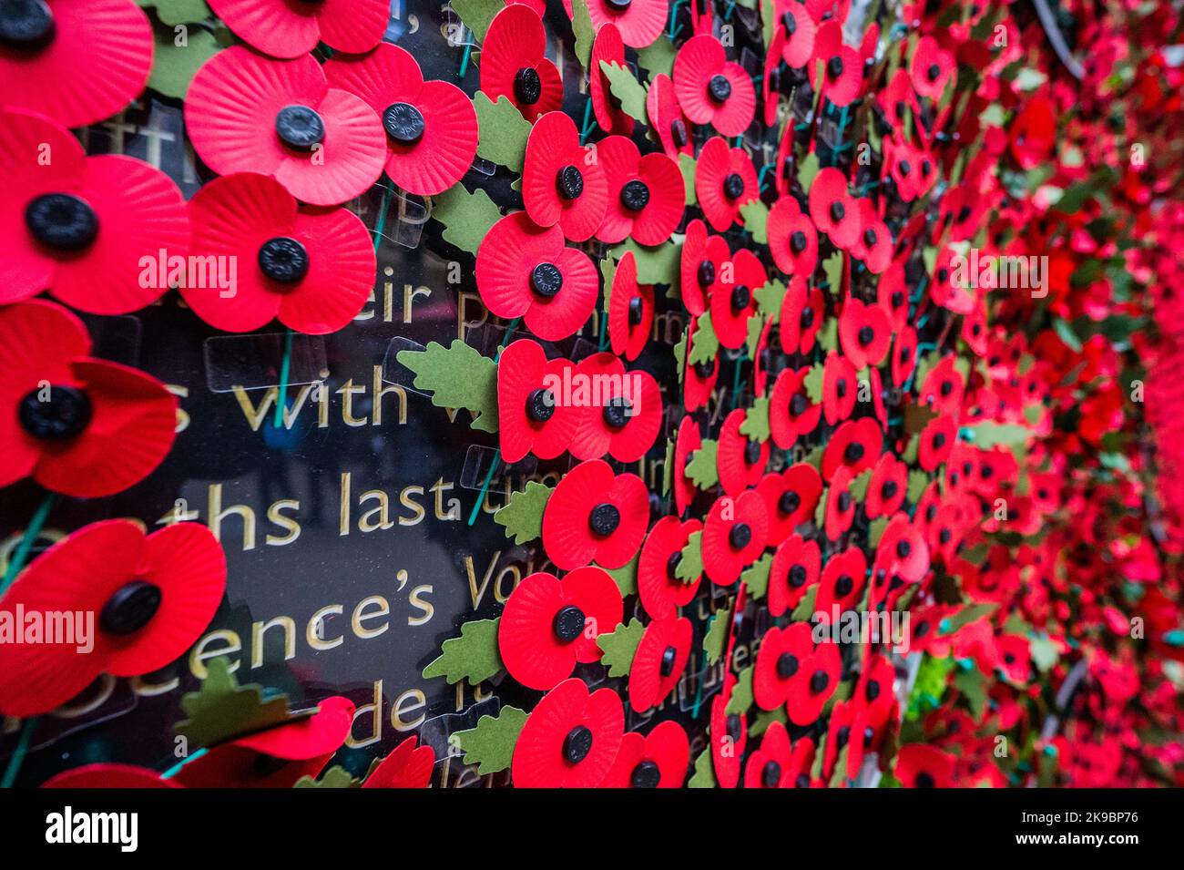 London, UK. 27th Oct, 2022. The Royal British Legion's Poppy Appeal 2022 launches with a 6-metre-wide wall of poppies featuring stories of veterans, RBL beneficiaries (many having received lifechanging support) and their families - the people behind the poppy. Members of the public were invited to take a paper poppy from the wall to uncover the stories. The charity is urging people to wear a poppy this year to show that they care and that the service and sacrifice of serving personnel, veterans and their families will never be forgotten. Credit: Guy Bell/Alamy Live News Stock Photo