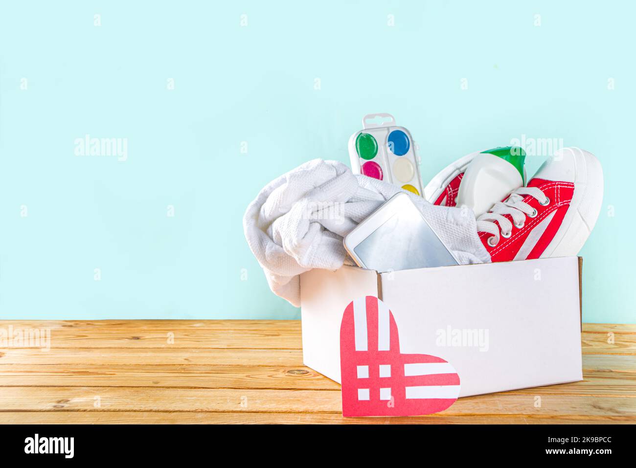 Donation Box with various give goods for Giving Tuesday, with red heart