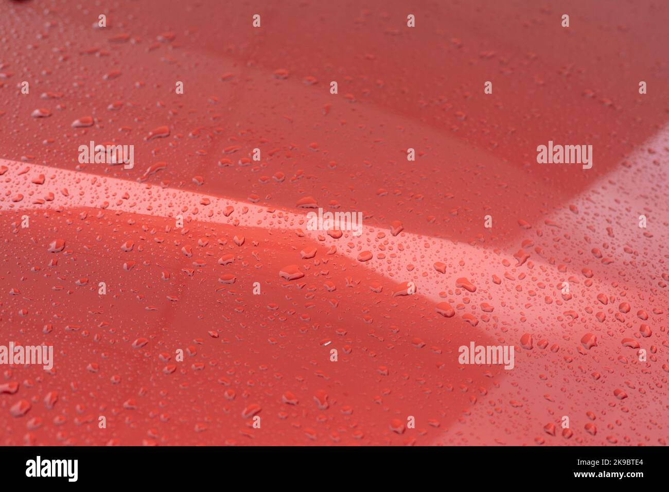 Drops on car. Surface of machine. Rain on transport. Texture of hood