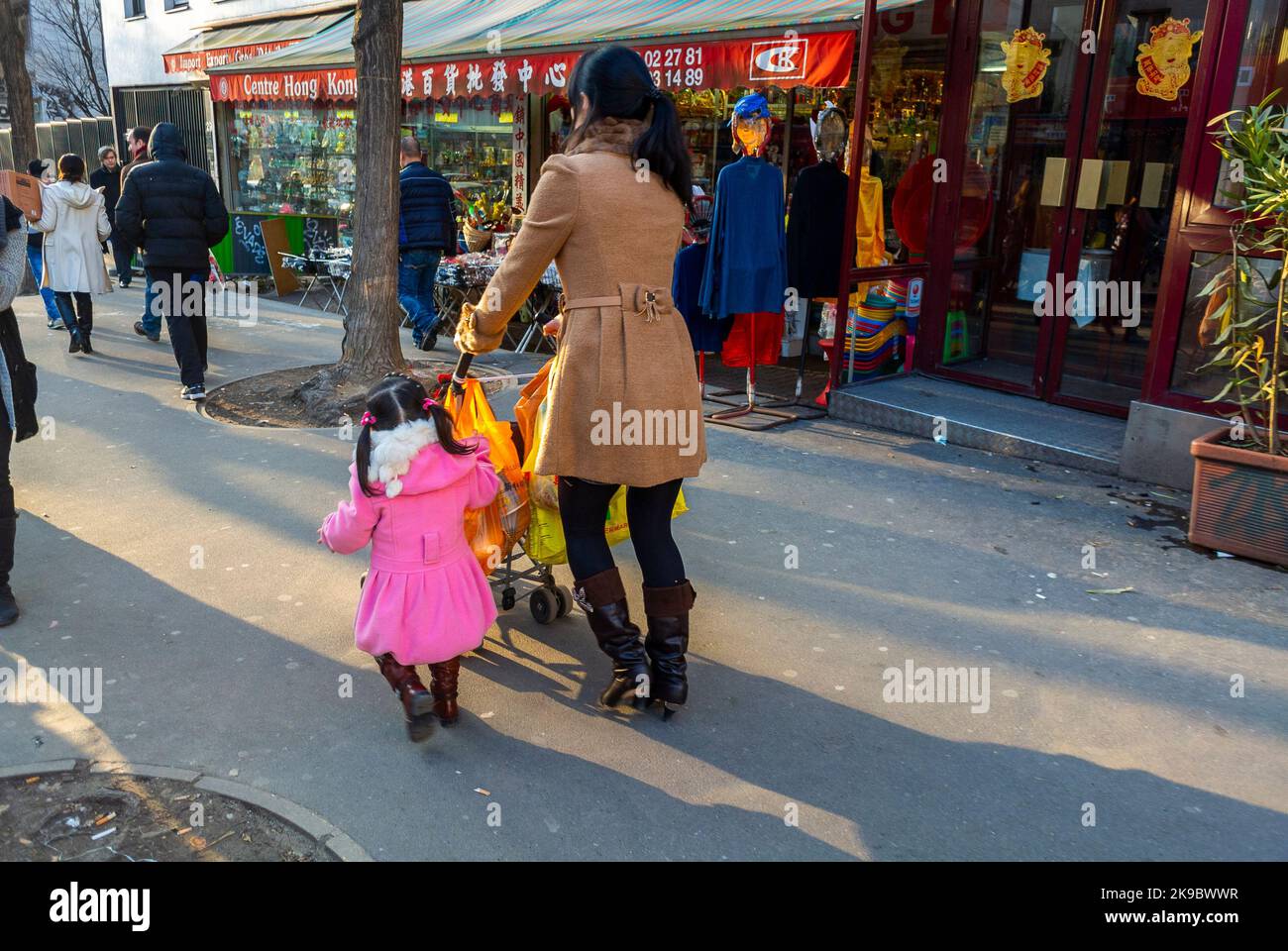 Paris, France, Chinese Mother with Children, Walking Away on Street ...
