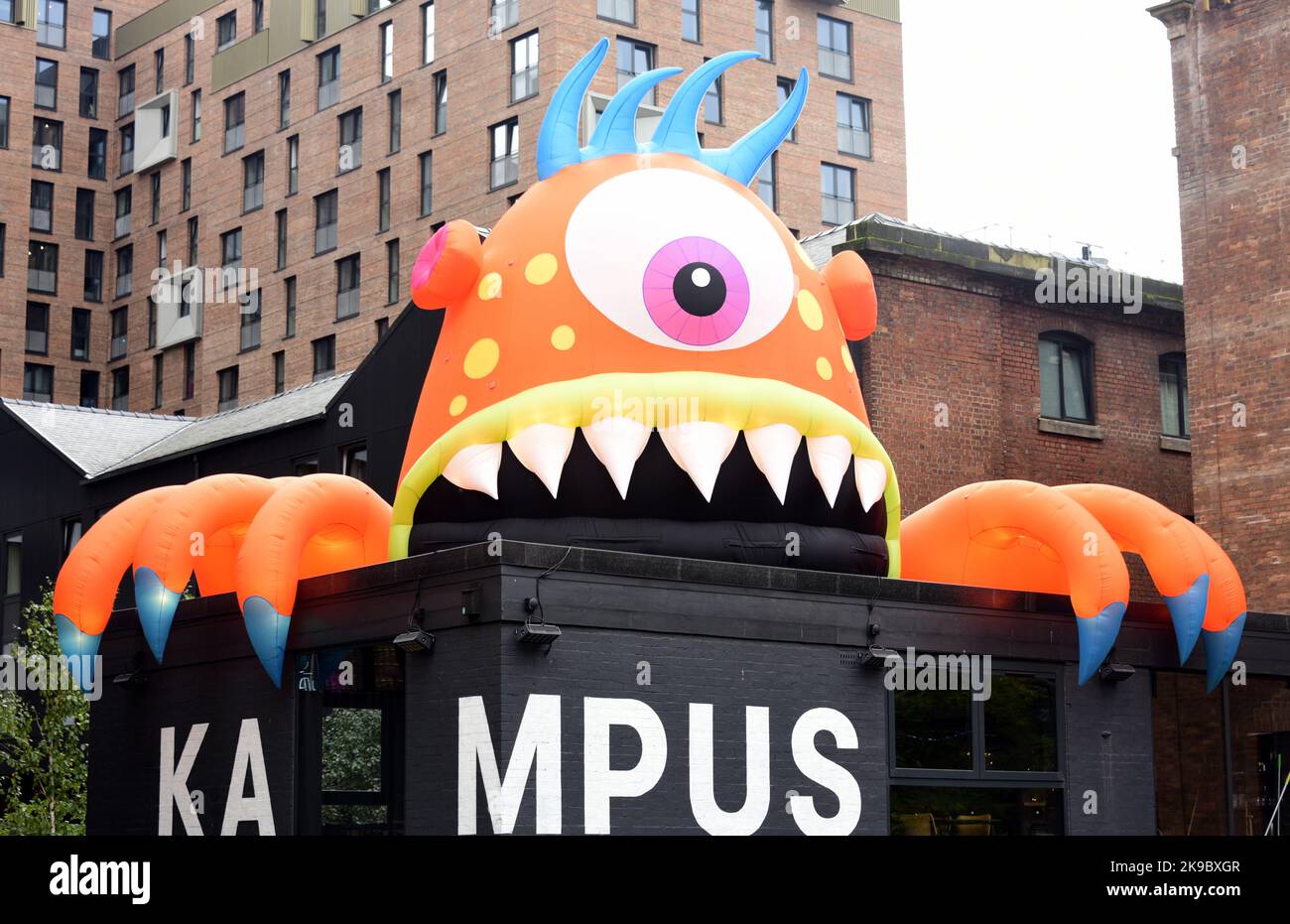 Manchester, UK. 27th October, 2022. An octopus giant inflatable monster, named Krampus, on top of Kampus, a canal-side garden neighbourhood. Halloween decorations appear in city centre Manchester, England, United Kingdom, ready for the  celebration of Halloween or Hallowe'en, as observed in many countries on 31 October, the eve of the Western Christian feast of All Hallows' Day. The festival begins the observance of Allhallowtide,a time to remember the dead, including saints or hallows and all the departed. Credit: Terry Waller/Alamy Live News Stock Photo