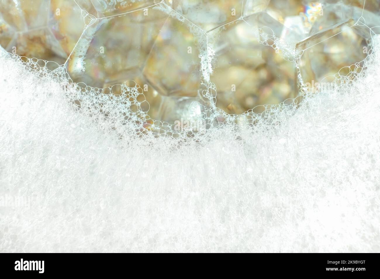 Soap foam with large and small bubbles closeup. Wash. Foam Stock Photo