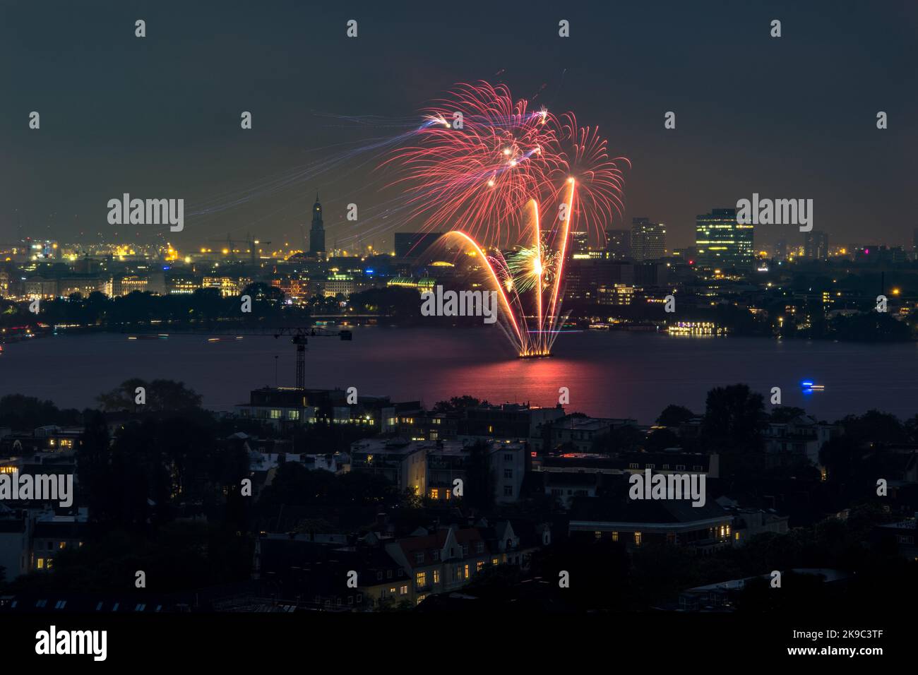 nightly panorama of Hamburg - Inner City with firework - Japanisches Kirschblütenfest in Hamburg Stock Photo