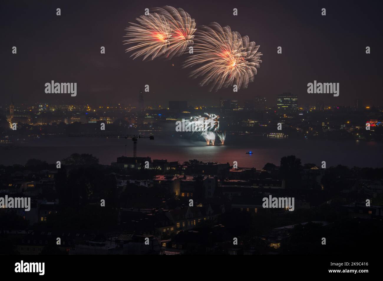 nightly panorama of Hamburg - Inner City with firework - Japanisches Kirschblütenfest in Hamburg Stock Photo
