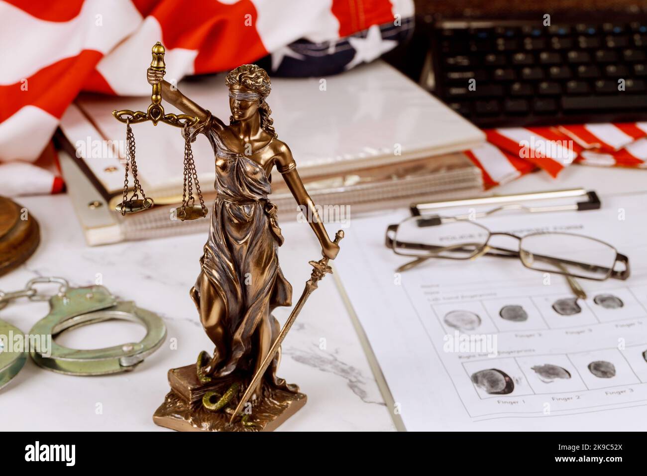 Statue of justice on law court with administrative document folders